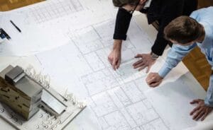 Architect planning blueprints for building a new home on Cape Cod
