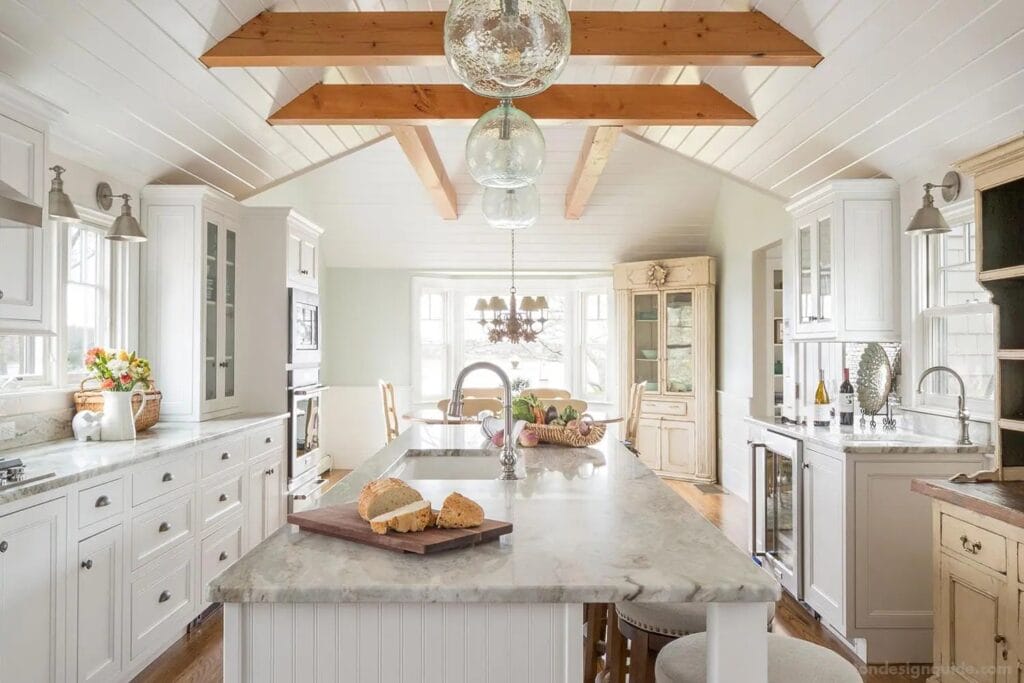 Bright white kitchen cabinets featured in a coastal Cape Cod remodeling project showcasing kitchen remodel cost Cape Cod homeowners can expect